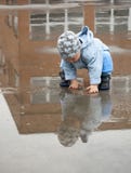 Child In A Puddle Stock Photography