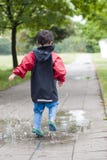 Child In Puddle Royalty Free Stock Photography