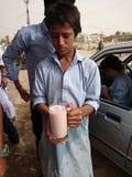 Child serving Thadhal drink stock images Child serving Thadhal drink stock images