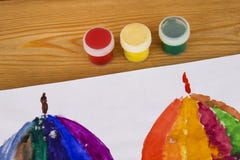 The child paints in watercolor, painting. Children`s drawing. Multicolored. Album for drawing. Kindergarten and school royalty free stock image The child paints in watercolor, painting. Children`s drawing. Multicolored. Album for drawing. Kindergarten and school royalty free stock image