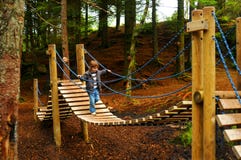 Child on playground bridge