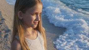 Child Playing on Beach in Sunset, Kid Watching Sea Waves, Girl Portrait on Shore royalty free stock images Child Playing on Beach in Sunset, Kid Watching Sea Waves, Girl Portrait on Shore royalty free stock images