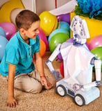 Child playing robot toy. Kid play in primary school. Stock Photos Child playing robot toy. Kid play in primary school. Stock Photos