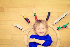 Child playing with trains indoor Stock Images Child playing with trains indoor Stock Images