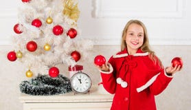 Child red costume hold christmas ornament ball. Christmas ball traditional decor. Top christmas decorating ideas for royalty free stock photography Child red costume hold christmas ornament ball. Christmas ball traditional decor. Top christmas decorating ideas for royalty free stock photography