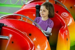 Child Riding On A Roller Coaster Stock Photo