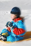 Child Sliding From Hill Stock Photography