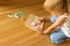 Child Solving Puzzle Stock Photo Child Solving Puzzle Stock Photo