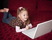 Child using a laptop computer stock photo Child using a laptop computer stock photo