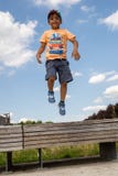 A child jumping, levitating in the air. Casual portrait.