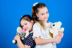 Childhood concept. Kids adorable cute girls play with soft toys. Happy childhood. Child care. Excellence in early stock photos Childhood concept. Kids adorable cute girls play with soft toys. Happy childhood. Child care. Excellence in early stock photos