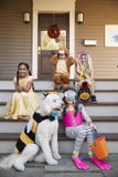 Children And Dog In Halloween Costumes For Trick Or Treating stock photography Children And Dog In Halloween Costumes For Trick Or Treating stock photography