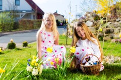 Children on Easter egg hunt with bunny royalty free stock photo Children on Easter egg hunt with bunny royalty free stock photo