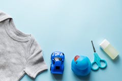 children flat lay with clothes blue background top view space for text. blue car , duck , oil royalty free stock images children flat lay with clothes blue background top view space for text. blue car , duck , oil royalty free stock images