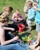 Children going through their Easter Egg Hunt Treas Stock Images Children going through their Easter Egg Hunt Treas Stock Images