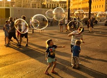 Children making large soap bubbles Royalty Free Stock Photography Children making large soap bubbles Royalty Free Stock Photography