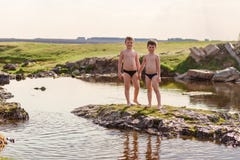 Children Play On The River In Summer Stock Images