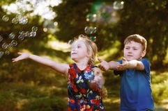 Children Play With Soap Bubbles In The Park Royalty Free Stock Photography Children Play With Soap Bubbles In The Park Royalty Free Stock Photography
