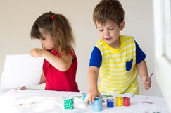 Children playing and drawing at home or kindergarten or playschool stock photos Children playing and drawing at home or kindergarten or playschool stock photos