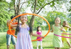 Children Playing With Hoola Hoops stock photo Children Playing With Hoola Hoops stock photo