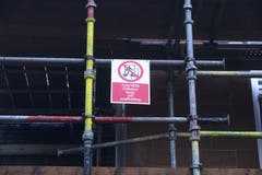 Children playing on scaffold not allowed safety sign at construction building site royalty free stock photography Children playing on scaffold not allowed safety sign at construction building site royalty free stock photography