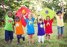 Children Playing Superhero With Kites