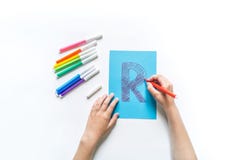 Children`s Hands Write The Letter R Felt-tip Pen Royalty Free Stock Photos