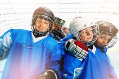 Children`s ice hockey team celebrating victory stock photos Children`s ice hockey team celebrating victory stock photos