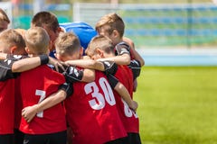 Children sports soccer team. Kids standing together on the football pitch royalty free stock photography Children sports soccer team. Kids standing together on the football pitch royalty free stock photography