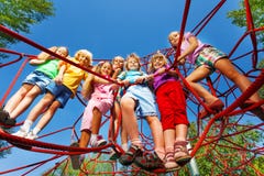 Children stand close on ropes of playground net royalty free stock photos Children stand close on ropes of playground net royalty free stock photos