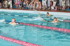 Children swimming freestyle at swimming lesson stock photo Children swimming freestyle at swimming lesson stock photo