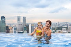 Kids swim in Singapore roof top swimming pool Stock Photo Kids swim in Singapore roof top swimming pool Stock Photo