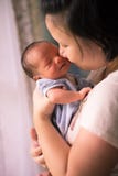 Chinese Asian Malaysian mother and her newborn infant baby boy stock image Chinese Asian Malaysian mother and her newborn infant baby boy stock image