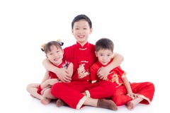 Chinese Children Wearing Traditional Costume Sitting And Smile On The Floor Royalty Free Stock Photo