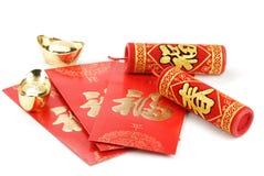 Chinese new year decoration. Red envelope,gold ingot and firecrackers,isolated on white Chinese new year decoration. Red envelope,gold ingot and firecrackers,isolated on white