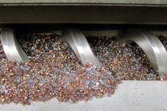Chip conveyor. And many metal chip from lathe machine, CNC machine royalty free stock image Chip conveyor. And many metal chip from lathe machine, CNC machine royalty free stock image