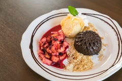 Chocolate cake with fruit peach, black currant, blueberry, apple royalty free stock photography Chocolate cake with fruit peach, black currant, blueberry, apple royalty free stock photography