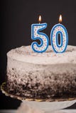 Chocolate cream cake with 50 candle on top. Selective focus on Stock Photography Chocolate cream cake with 50 candle on top. Selective focus on Stock Photography