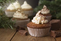 Chocolate cupcakes with whipped cream on rustic wooden table. Homemade dessert. stock photography Chocolate cupcakes with whipped cream on rustic wooden table. Homemade dessert. stock photography