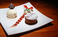 Chocolate fondant lava cake with vanilla ice cream, creamy sauce stock photography Chocolate fondant lava cake with vanilla ice cream, creamy sauce stock photography