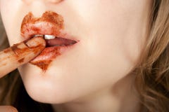 Chocolate Heart On Lips Stock Photos