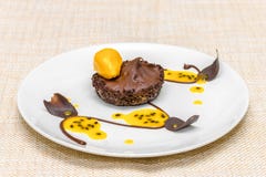 Chocolate tartlet with mousse and sorbet stock image Chocolate tartlet with mousse and sorbet stock image