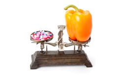 Choice between two sources of vitamins - pills or healthy food. stock images Choice between two sources of vitamins - pills or healthy food. stock images