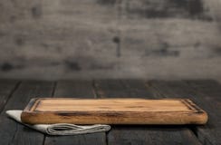 Free Chopping Board On Dark Wooden Background Close Up Royalty Free Stock Photography - 82572807
