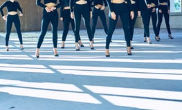 Choreography of girls dancing with black mayas and heels royalty free stock photo Choreography of girls dancing with black mayas and heels royalty free stock photo