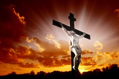 Christian cross in sunrise