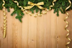 Christmas background with firtree, bow and ribbons on wood royalty free stock photography Christmas background with firtree, bow and ribbons on wood royalty free stock photography
