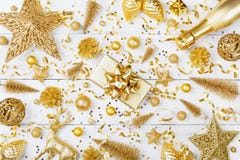 Christmas background with golden gift or present box, champagne and holiday decorations on white table top view. Flat lay royalty free stock photos Christmas background with golden gift or present box, champagne and holiday decorations on white table top view. Flat lay royalty free stock photos