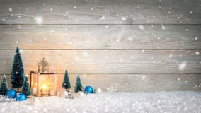 Christmas background with wood, snow and lantern stock photo Christmas background with wood, snow and lantern stock photo