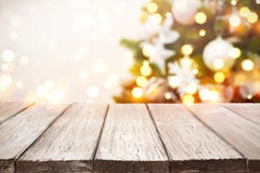 Christmas Background. Wooden Planks Over Blurred Holiday Tree Lights Royalty Free Stock Images Christmas Background. Wooden Planks Over Blurred Holiday Tree Lights Royalty Free Stock Images